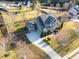 Charming two-story home with a well-maintained lawn, driveway, and manicured shrubs at 4535 Meadow Green Ln, Acworth, GA 30101