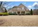 Charming brick two-story home with a welcoming front porch and well-maintained landscaping at 4535 Meadow Green Ln, Acworth, GA 30101