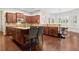 Bright kitchen featuring wooden floors, stainless steel appliances, and a large island with seating at 4535 Meadow Green Ln, Acworth, GA 30101