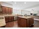 Modern kitchen with stainless steel appliances, a center island, granite countertops, and an adjacent living area at 4535 Meadow Green Ln, Acworth, GA 30101