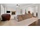 Cozy living room featuring a stone fireplace, built-in shelving, and a comfortable seating area at 4535 Meadow Green Ln, Acworth, GA 30101