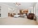 Open-concept living room with a large sectional sofa and access to the kitchen at 4535 Meadow Green Ln, Acworth, GA 30101