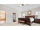 Spacious main bedroom with a tray ceiling, a sitting area, and an ensuite bathroom at 4535 Meadow Green Ln, Acworth, GA 30101