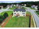 Overhead view of the home, its fenced backyard, and the surrounding residential area at 6793 Oconee Pl, Fairburn, GA 30213