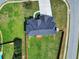 Birds eye view of a house showcasing its new roof, backyard, and landscaping with a fence surrounding the property at 6793 Oconee Pl, Fairburn, GA 30213
