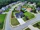 A beautiful home boasts a spacious yard, complemented by a long driveway and inviting curb appeal in a Gathering-friendly neighborhood at 6793 Oconee Pl, Fairburn, GA 30213