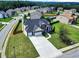A home features a well-kept lawn and established landscaping, providing curb appeal in a quiet, suburban neighborhood setting at 6793 Oconee Pl, Fairburn, GA 30213