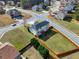 Aerial view highlighting the property's backyard, neighborhood location, and proximity to nearby amenities at 6793 Oconee Pl, Fairburn, GA 30213
