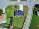 An aerial view of a home featuring a well-maintained lawn and a newly installed roof in a quiet neighborhood at 6793 Oconee Pl, Fairburn, GA 30213