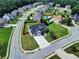 An aerial shot of home with mature landscaping, driveway, and a two car garage at 6793 Oconee Pl, Fairburn, GA 30213