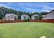 Aerial shot featuring a large, enclosed backyard, highlighting the outdoor living space and neighborhood setting at 6793 Oconee Pl, Fairburn, GA 30213
