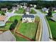 Aerial view of the home featuring a backyard, fence, and the surrounding neighborhood at 6793 Oconee Pl, Fairburn, GA 30213