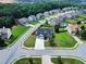 A suburban home sits on a well-manicured lot, featuring a lush lawn and a convenient two-car garage with ample street parking at 6793 Oconee Pl, Fairburn, GA 30213