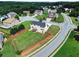 Aerial view of the property, showing the backyard, deck, and surrounding neighborhood at 6793 Oconee Pl, Fairburn, GA 30213