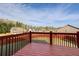 Back deck and fenced yard show well maintained green grass and landscaping in a Gathering-friendly neighborhood at 6793 Oconee Pl, Fairburn, GA 30213