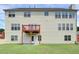Backyard showcasing a spacious deck, access to the backyard, and level grassy area at 6793 Oconee Pl, Fairburn, GA 30213