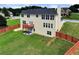 Well-manicured backyard with a wooden fence and a small deck, offering a great space for outdoor activities and relaxation at 6793 Oconee Pl, Fairburn, GA 30213