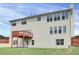 Large, flat backyard showing the deck, fencing and windows at 6793 Oconee Pl, Fairburn, GA 30213