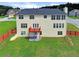 Expansive backyard featuring a deck, privacy fence, and ample green space at 6793 Oconee Pl, Fairburn, GA 30213