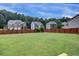 Large, level backyard with a wood fence offering privacy in a residential neighborhood at 6793 Oconee Pl, Fairburn, GA 30213