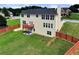 Aerial view of a large, fenced backyard with a wood deck on the back of the home at 6793 Oconee Pl, Fairburn, GA 30213