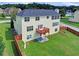 A large, level backyard with a deck, patio, and privacy fence at 6793 Oconee Pl, Fairburn, GA 30213