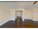 Spacious basement area with dark hardwood floors and open layout, great for entertaining or relaxing at 6793 Oconee Pl, Fairburn, GA 30213