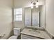 Upstairs bathroom features a granite vanity and modern fixtures at 6793 Oconee Pl, Fairburn, GA 30213