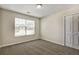 Carpeted bedroom features natural light, a double door closet, and neutral paint at 6793 Oconee Pl, Fairburn, GA 30213