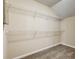 Walk-in closet with multiple shelves for optimal storage at 6793 Oconee Pl, Fairburn, GA 30213