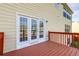 Deck featuring three French doors that seamlessly connect the indoor and outdoor living spaces at 6793 Oconee Pl, Fairburn, GA 30213