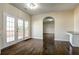 Dining area with dark hardwood floors and French doors leading to the backyard deck at 6793 Oconee Pl, Fairburn, GA 30213