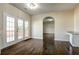 This bright dining room features hardwood floors and french doors leading to the deck at 6793 Oconee Pl, Fairburn, GA 30213