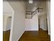 Inviting foyer showcases hardwood floors, a staircase with white railings, and neutral paint at 6793 Oconee Pl, Fairburn, GA 30213