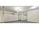 Spacious three-car garage offering ample parking and storage, complete with multiple doors at 6793 Oconee Pl, Fairburn, GA 30213