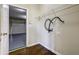 The laundry area adjacent to the garage features hardwood floors and shelving at 6793 Oconee Pl, Fairburn, GA 30213