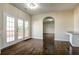 The living room features pristine hardwood floors and access to the deck at 6793 Oconee Pl, Fairburn, GA 30213