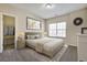 A beautiful main bedroom featuring an organized closet, natural light, and neutral decor at 6793 Oconee Pl, Fairburn, GA 30213