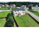 Beautiful home rear showing the deck, large fenced yard, and neighborhood setting at 6793 Oconee Pl, Fairburn, GA 30213