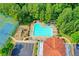 Overhead view of the pool and playground area, complete with lounge chairs and a parking area close by at 8070 Georgetown Cir, Suwanee, GA 30024