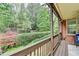 Charming backyard featuring a landscaped yard with a wooden railing, perfect for enjoying the outdoors at 8070 Georgetown Cir, Suwanee, GA 30024