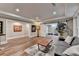 Spacious finished basement with hardwood floors, offering ample room for entertaining and relaxation at 8070 Georgetown Cir, Suwanee, GA 30024