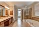 Relax in this spacious bathroom with a soaking tub, walk-in shower, and a double sink vanity at 8070 Georgetown Cir, Suwanee, GA 30024