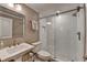 Bathroom featuring a glass door shower, a vanity with a sink, and modern fixtures at 8070 Georgetown Cir, Suwanee, GA 30024