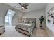 Cozy bedroom featuring a neutral color palette, ceiling fan, and a comfortable-looking bed at 8070 Georgetown Cir, Suwanee, GA 30024