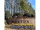Welcoming Weston community sign with colorful flowers and lush landscaping at the entrance at 8070 Georgetown Cir, Suwanee, GA 30024