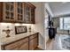 Elegant dining area with custom built-in cabinets and granite countertop for sophisticated entertaining at 8070 Georgetown Cir, Suwanee, GA 30024
