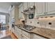 Gourmet kitchen features sleek countertops, stainless steel appliances, and modern fixtures for culinary excellence at 8070 Georgetown Cir, Suwanee, GA 30024