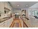 Gourmet kitchen features a spacious island, granite counters, and stainless-steel appliances for culinary excellence at 8070 Georgetown Cir, Suwanee, GA 30024