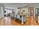 Spacious kitchen features a center island with granite countertops and seating for four, perfect for casual dining at 8070 Georgetown Cir, Suwanee, GA 30024